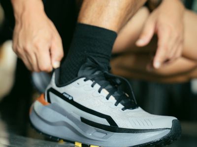 Close-up of athletic footwear on a clean floor, ready for action.